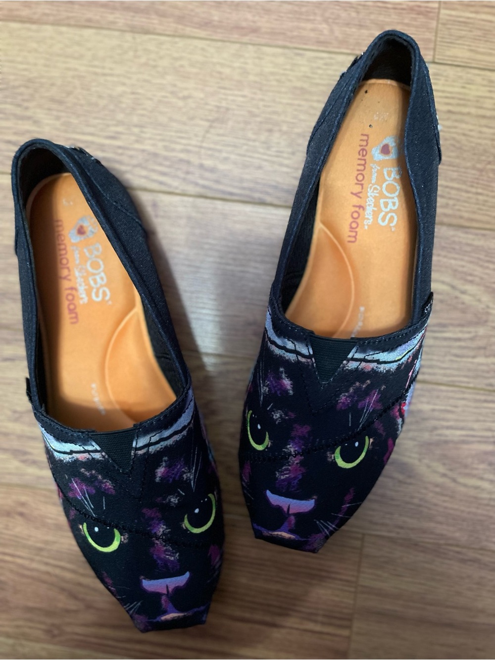BOBS from Skechers Cat Black Slip-On Shoe with Orange Insole